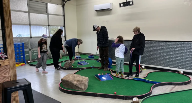 Indoor axe throwing, smash room, and mini golf for any event or celebration at North Plains entertainment venue.