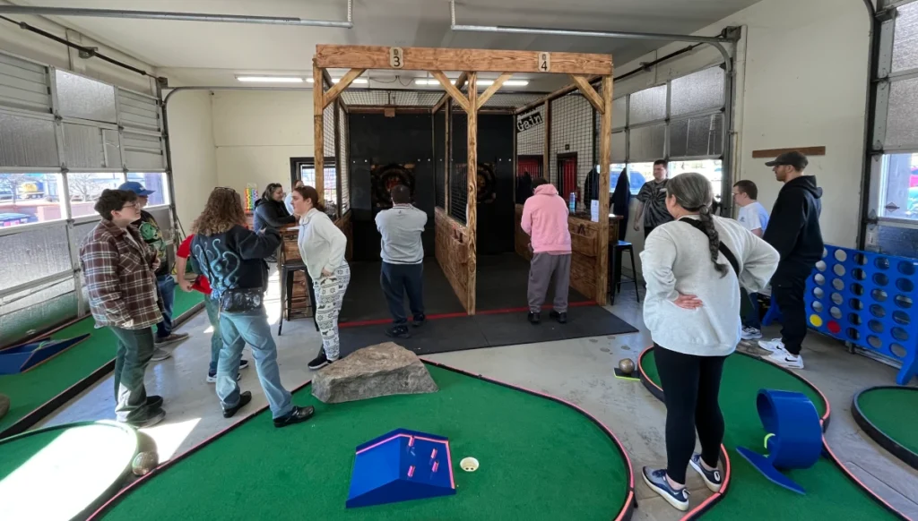 Indoor axe throwing, smash room, and mini golf for any event or celebration at North Plains entertainment venue.
