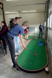 Indoor axe throwing, smash room, and mini golf for any event or celebration at North Plains entertainment venue.